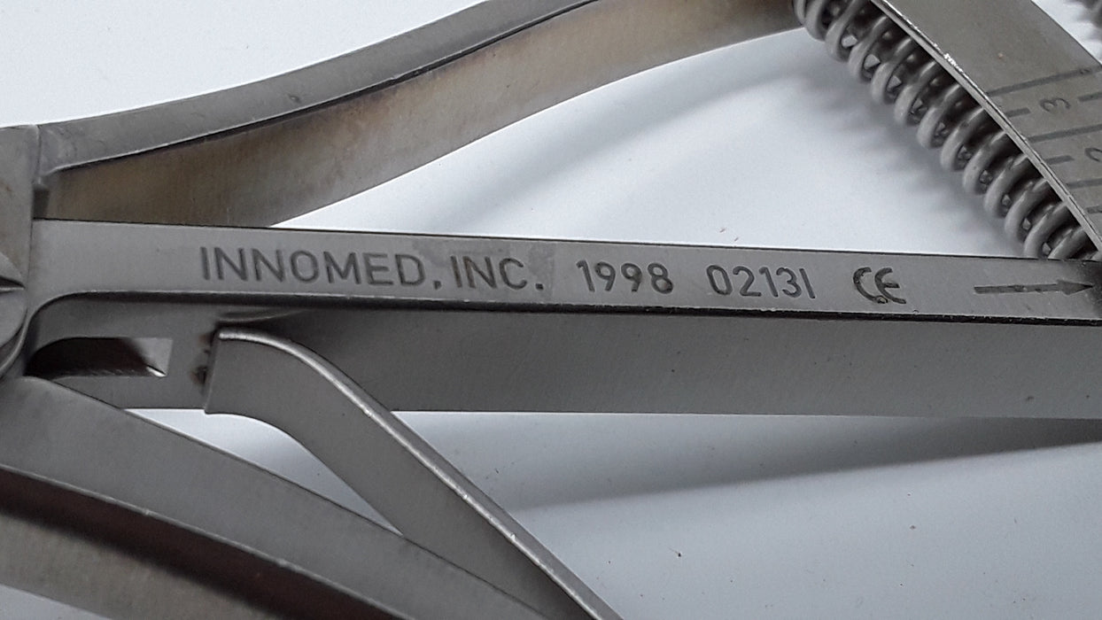 Innomed, Inc. 1998 Round Pad Scott Femoral Tibial Tensor Spreader