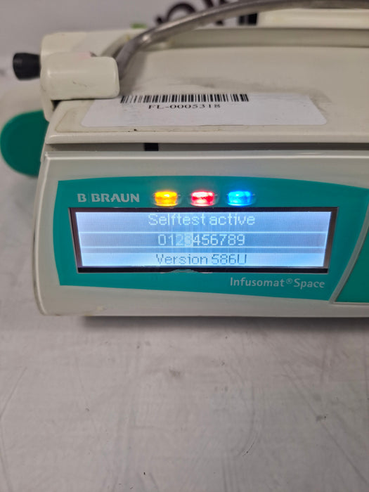 B. Braun Infusomat Space w/Pole Clamp & AC Adapter Infusion Pump